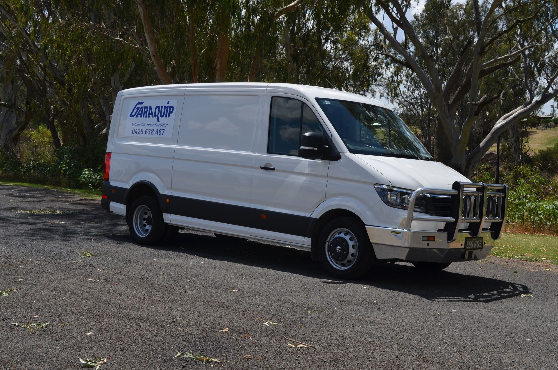 Garaquip Mobile Work Van With Garaquip Logo on It Parked Outside — Vehicle Hoist Near Dubbo