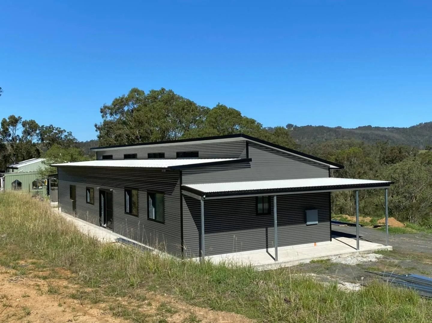 Gray Building with A Corrugated Metal Roof — Fair Dinkum Builds Port Stephens in Bobs Farm, NSW