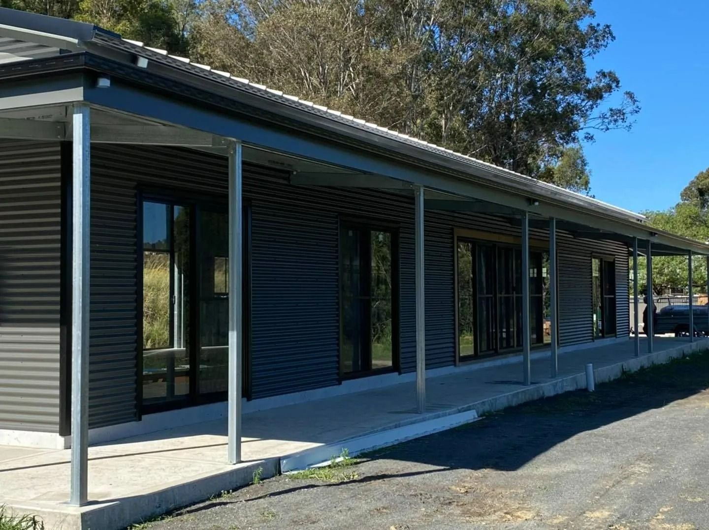 Building with A Corrugated Metal Facade, a Long Covered Porch — Fair Dinkum Builds Port Stephens in Bobs Farm, NSW