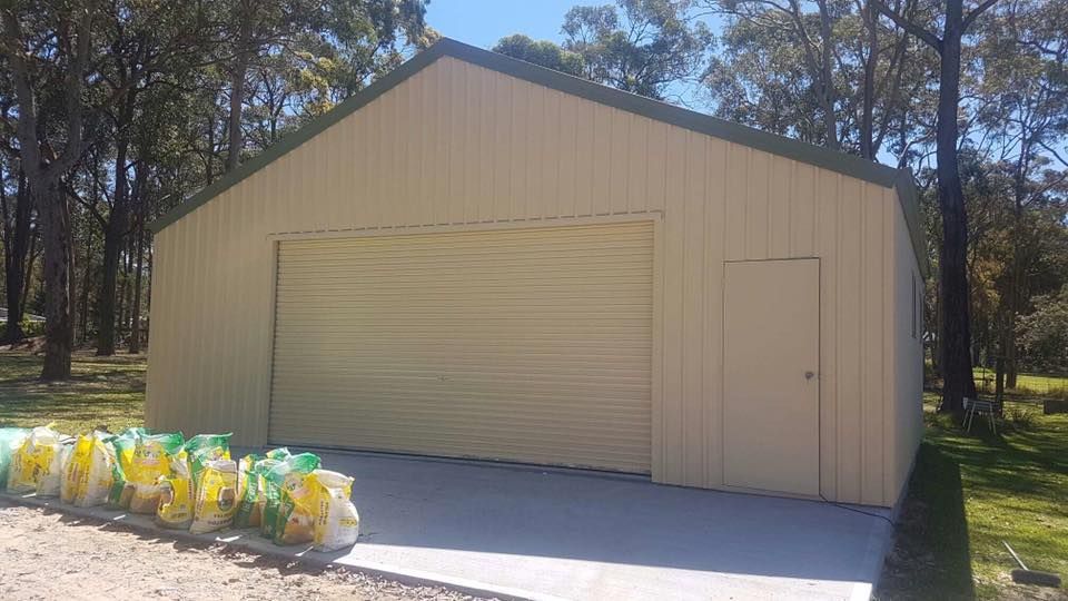 Beige Metal Shed with A Roller Door — Fair Dinkum Builds Port Stephens in Bobs Farm, NSW