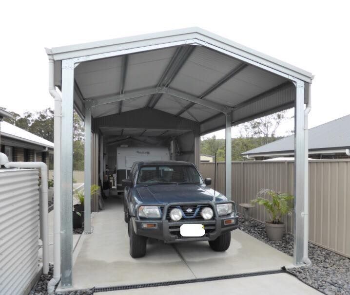 A Metal Carport Shelters a Truck and Caravan on A Concrete Pad — Fair Dinkum Builds Port Stephens in New Castle, NSW