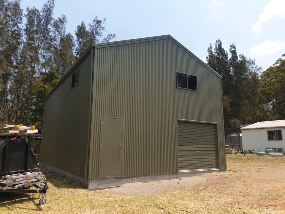 Large Olive-Green Metal Shed with A Roller Door — Fair Dinkum Builds Port Stephens in Hunter Valley, NSW