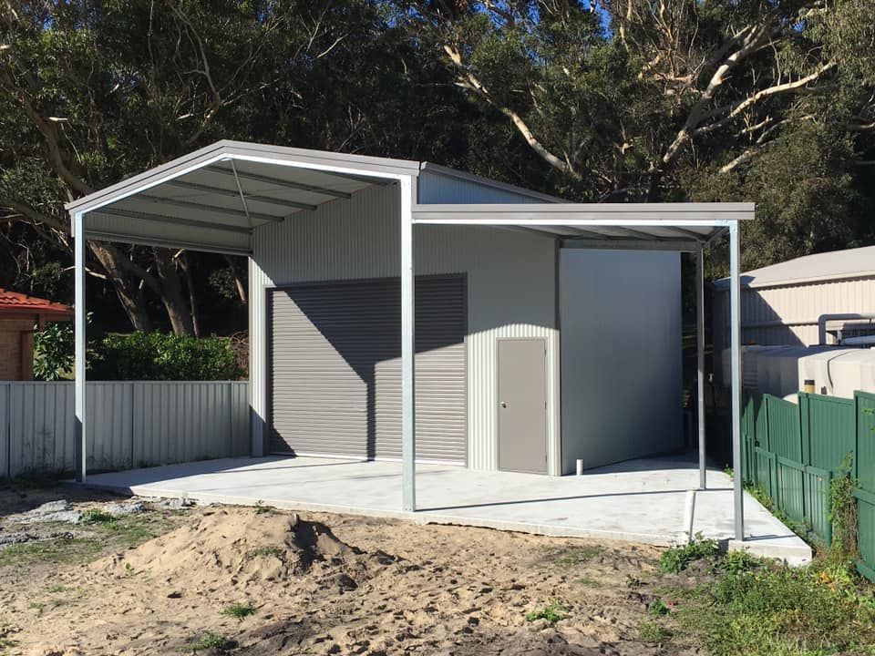 Gray Shed and Carport on A Concrete Pad, with A Roll-Up Garage Door — Fair Dinkum Builds Port Stephens in Bobs Farm, NSW