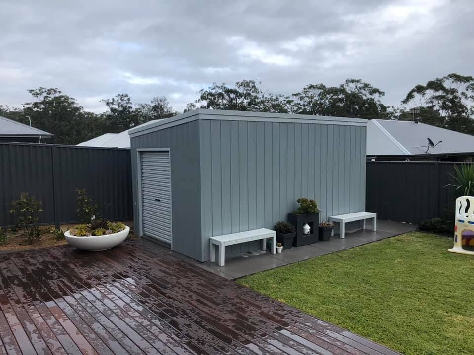 Gray Storage Shed with Closed Roller Door, Benches — Fair Dinkum Builds Port Stephens in Bobs Farm, NSW