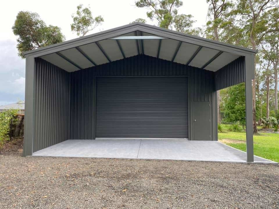 Gray Metal Shed with A Roller Door and Concrete Floor — Fair Dinkum Builds Port Stephens in Bobs Farm, NSW