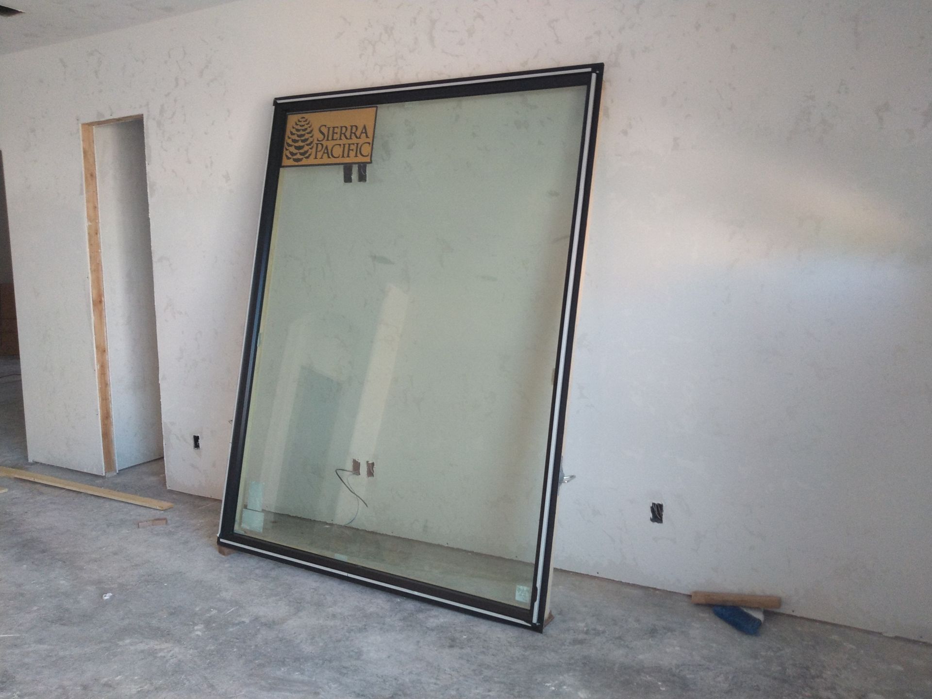 A large window in a room that says swan on it