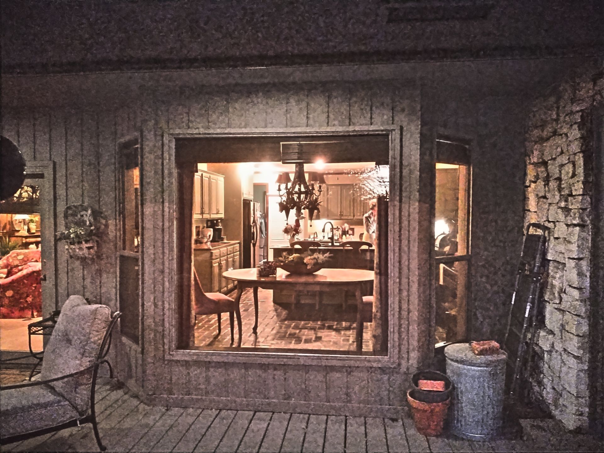 A view of a kitchen through a large window