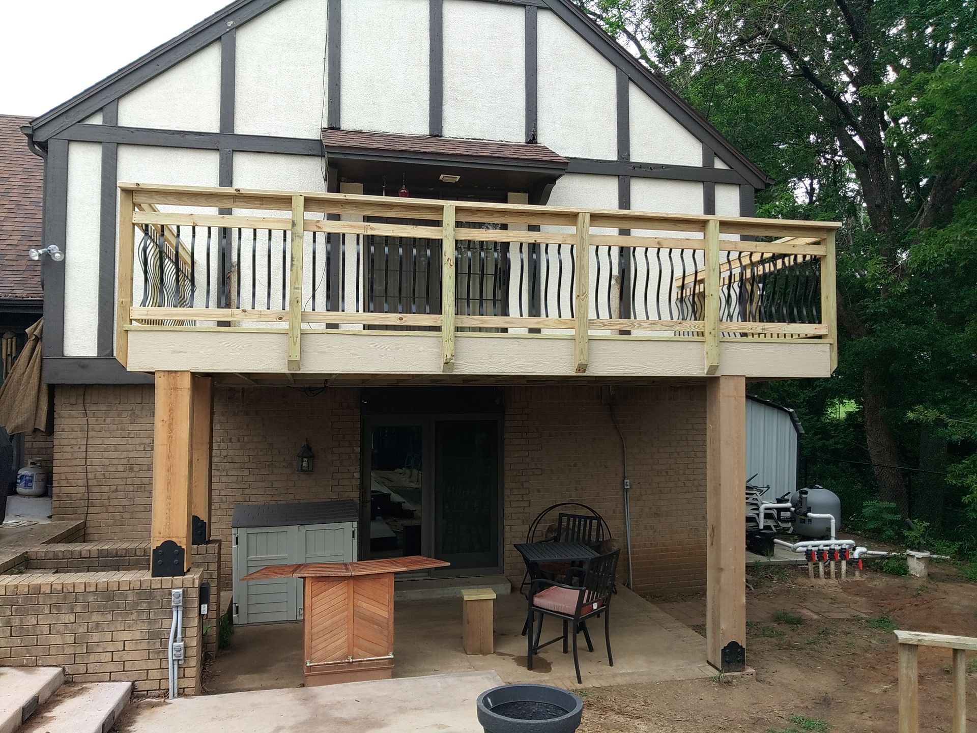 A house with a wooden deck and a table and chairs