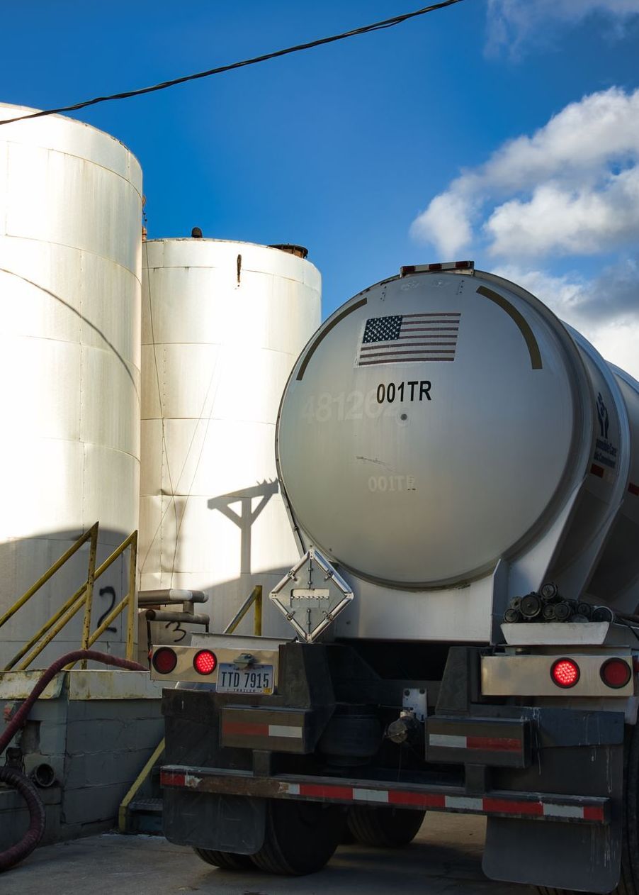 A tanker truck that says o4tr on the back