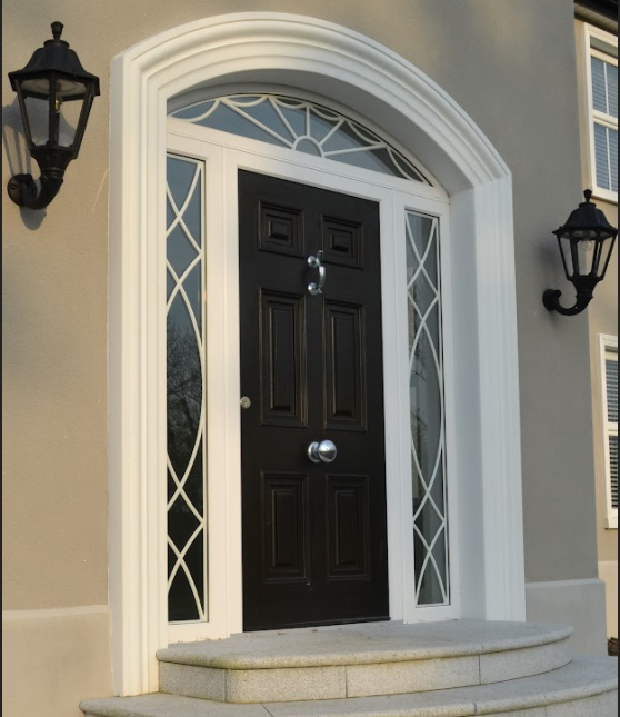 The front door of a house with a black door