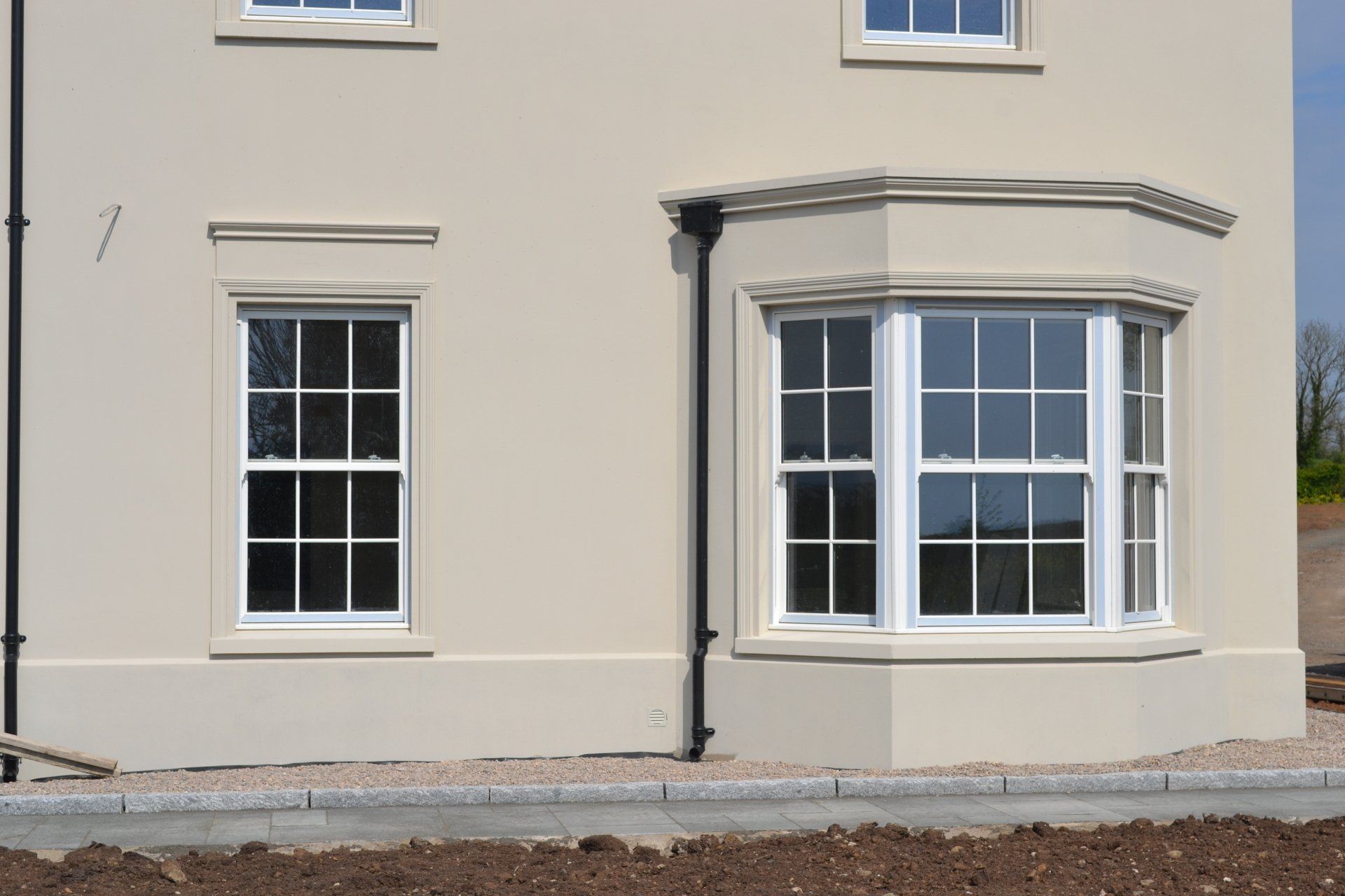 A house with a lot of windows on the side of it.