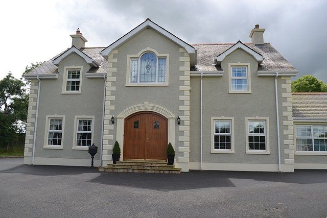 A large house with a lot of windows and doors