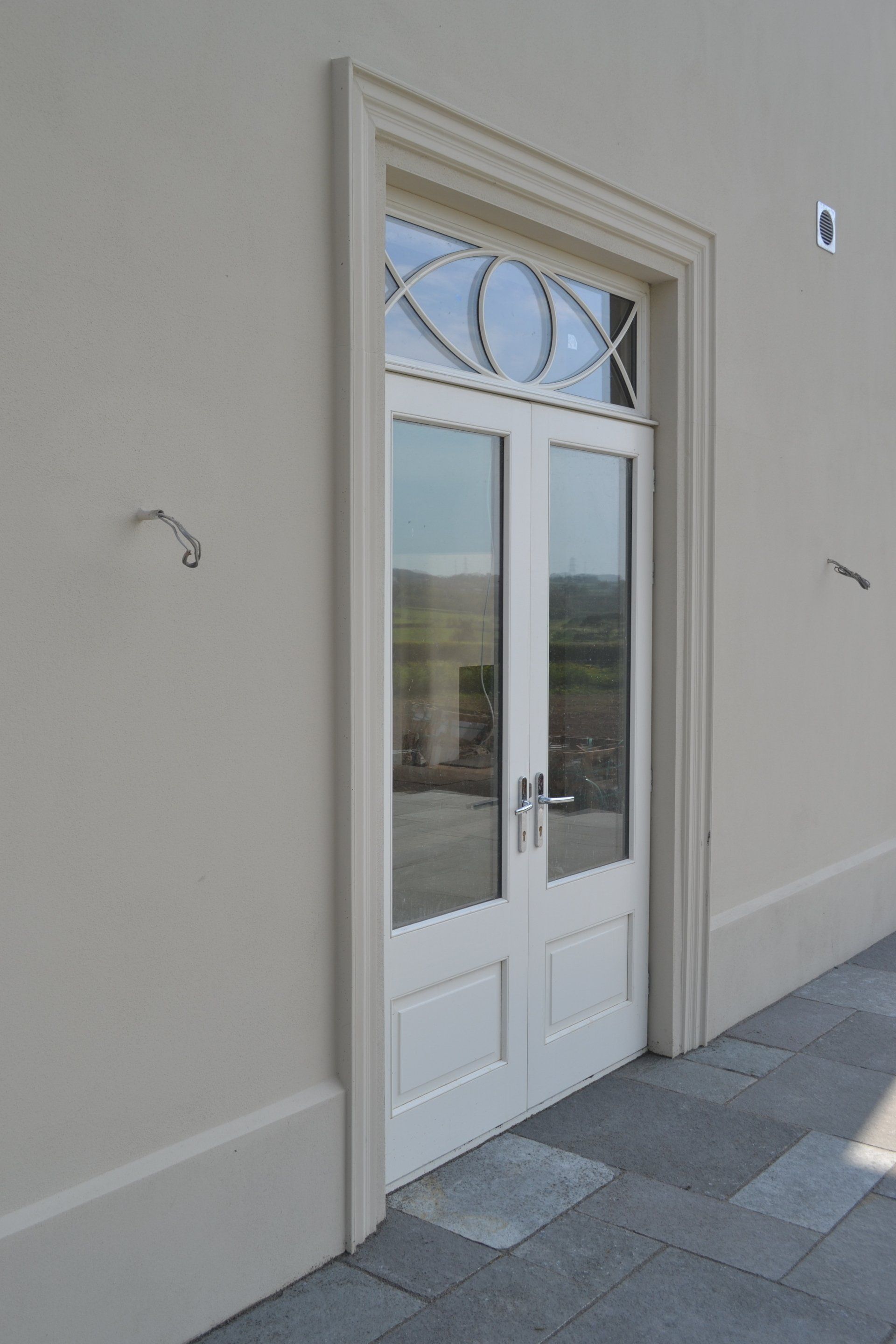 A white door with a window on top of it