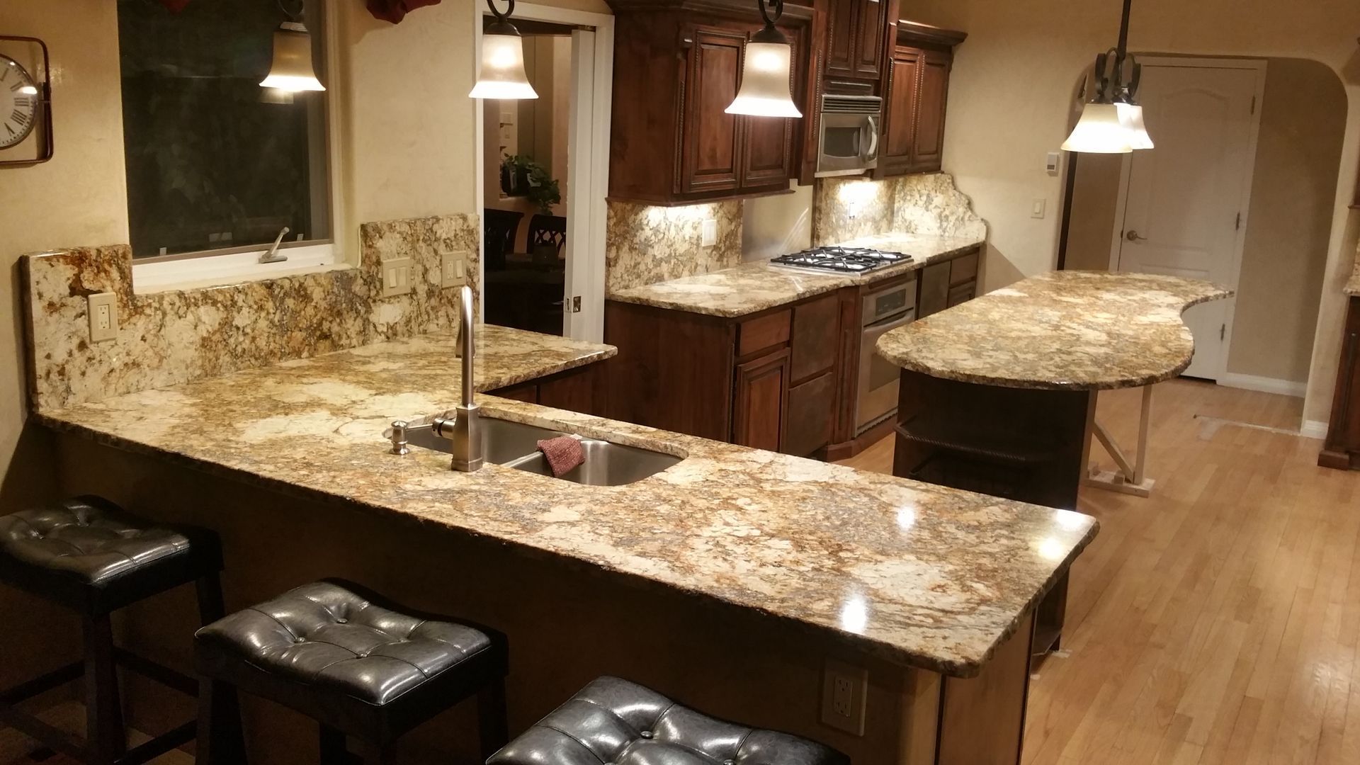 A kitchen with granite counter tops and a sink