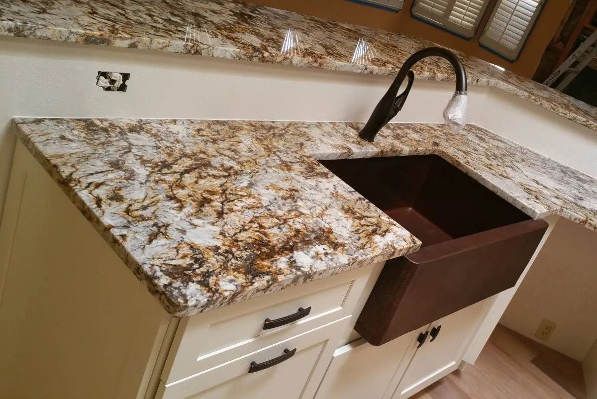 A kitchen with granite counter tops and a sink