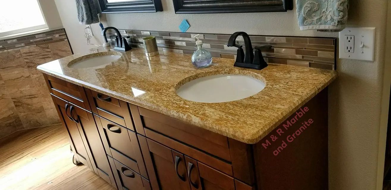 A bathroom vanity with two sinks and two mirrors.