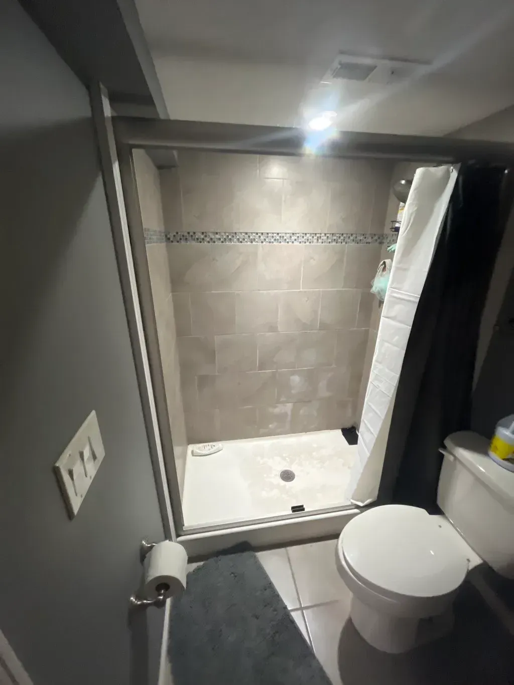 Air conditioning units with toolbox and gloves in backyard.