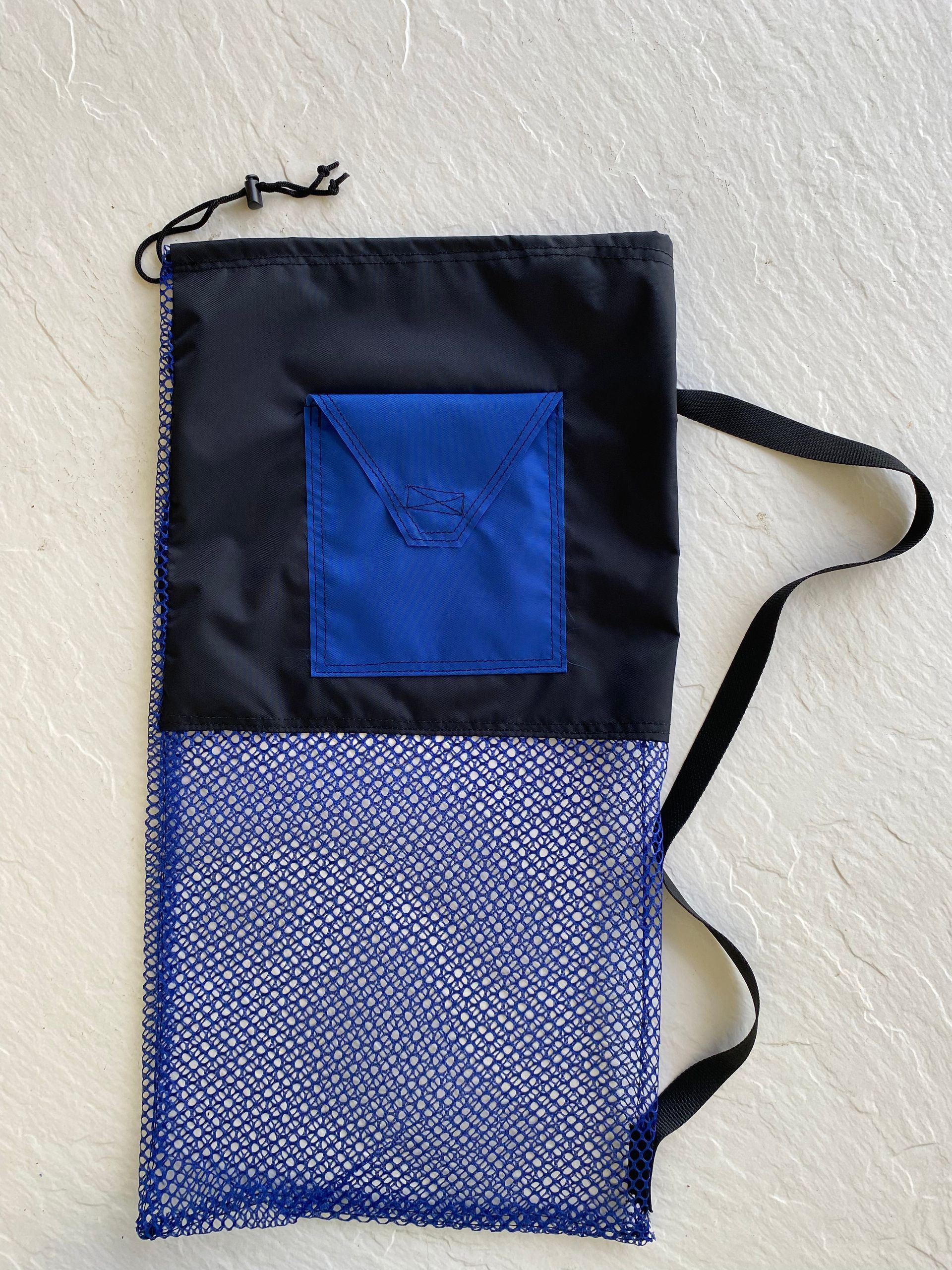Black and blue mesh bag with a blue square patch and a drawstring closure, on a light background.