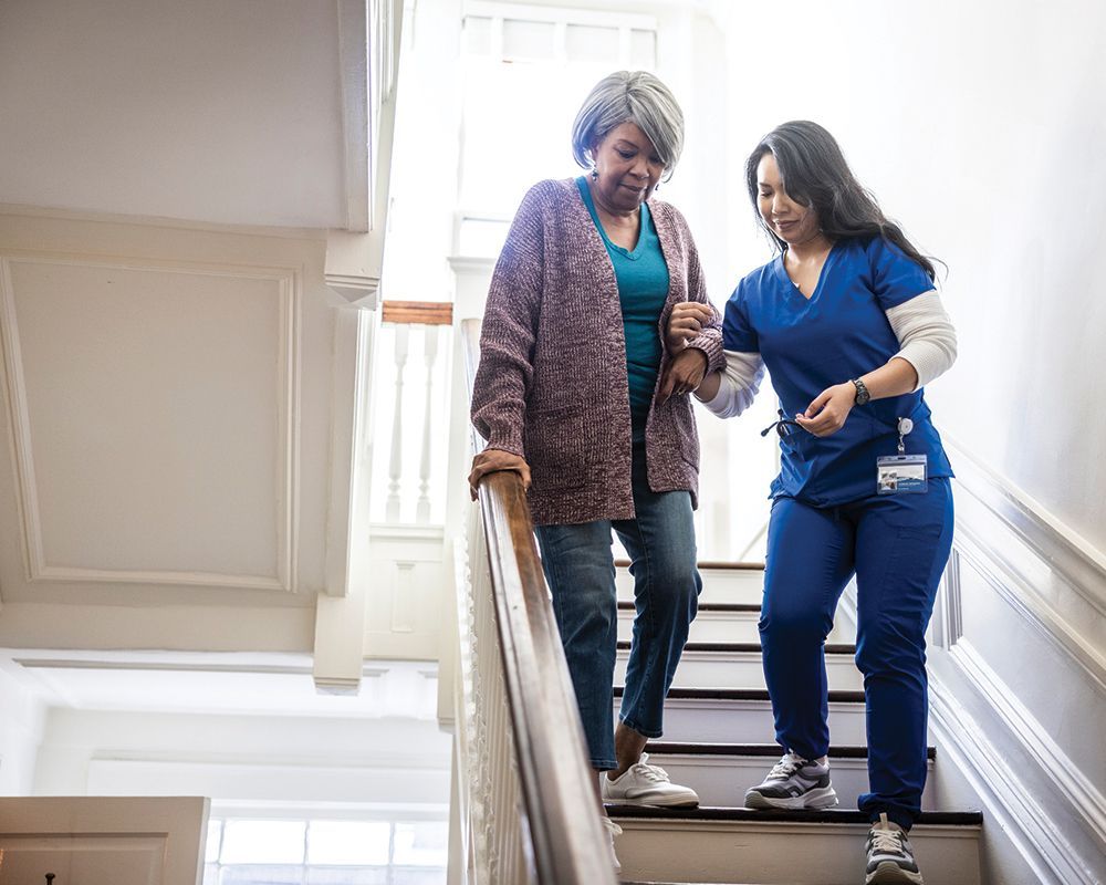 Nurse is Helping Elderly Woman on Stairs – Middlebury, IN – New Outlook Home Care of Northern IN LLC