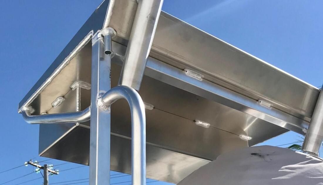 A Stainless Steel Table with A Blue Sky in The Background — Townsville Stainless Steel in Cairns, QLD