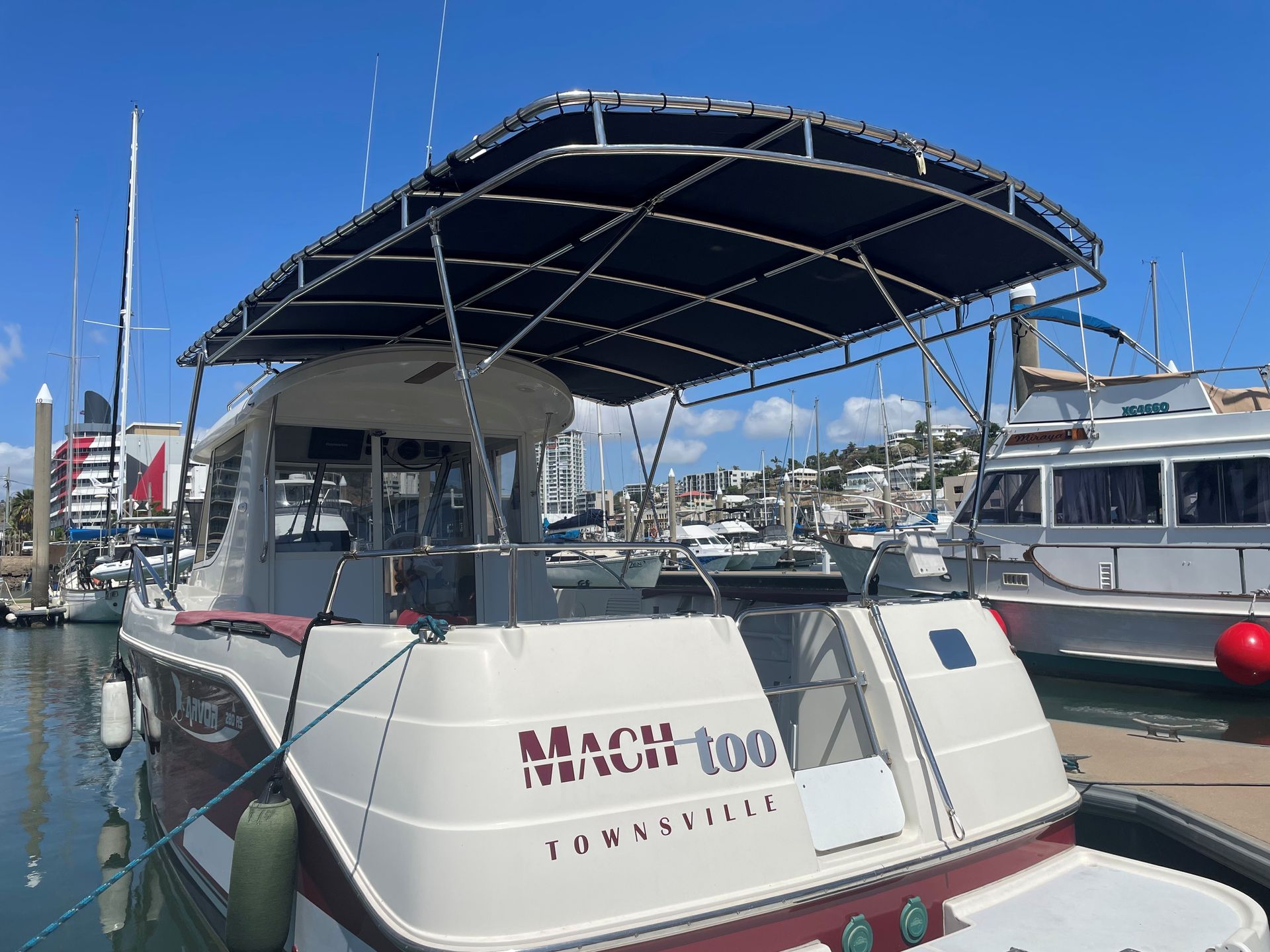 A White Sailboat With a Metal Frame and Sunshade Stands — Townsville Stainless Steel in Garbutt, QLD