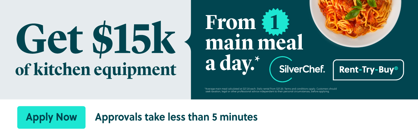 Two Workers in Yellow and Blue Work Shirts Smile at Each Other in a Workshop — Townsville Stainless Steel in Garbutt, QLD