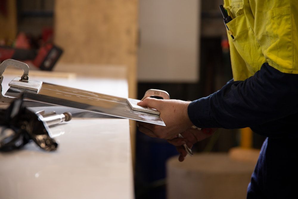 A Boat Is Docked in A Harbor with Boats — Townsville Stainless Steel in Garbutt, QLD