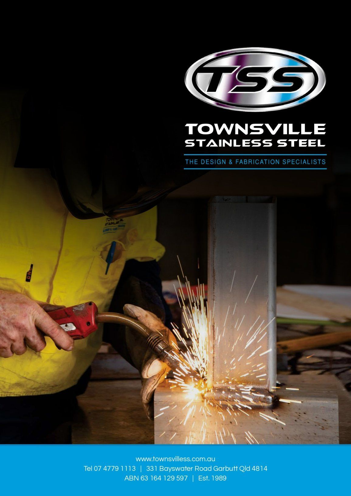 A Man Is Cutting a Piece of Metal with A Torch — Townsville Stainless Steel in Garbutt, QLD
