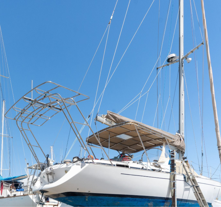 White and Navy Blue Motorboat on a Trailer, Under a Bright Sky — Townsville Stainless Steel in Garbutt, QLD