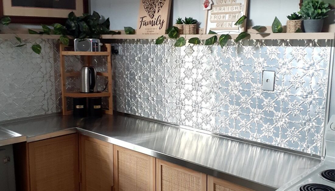 A Kitchen with A Stainless Steel Counter Top and A Sign that Says Family  — Townsville Stainless Steel in Garbutt, QLD