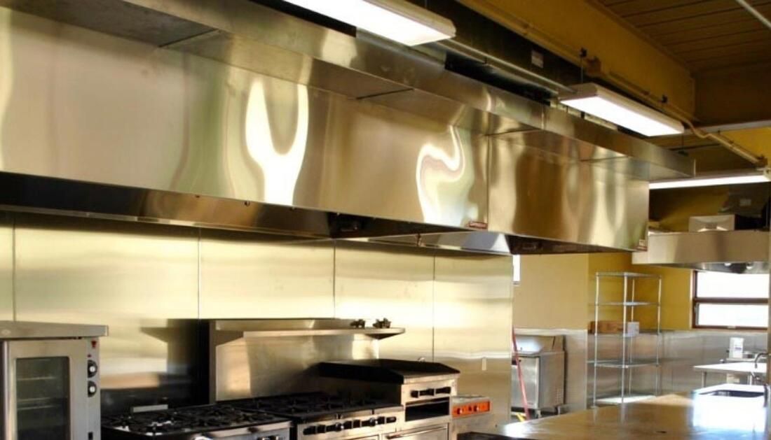 A Kitchen with Stainless Steel Appliances and A Microwave Oven — Townsville Stainless Steel in Garbutt, QLD