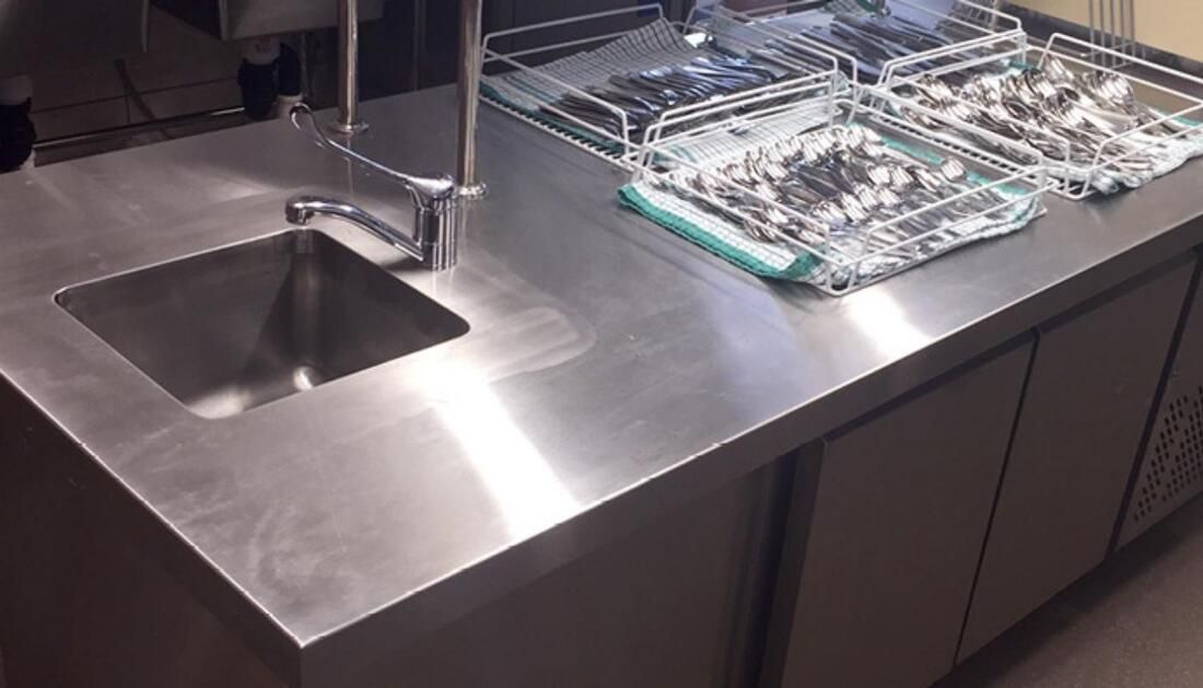 A Stainless Steel Counter Top with A Sink and Utensils on It — Townsville Stainless Steel in Cairns, QLD