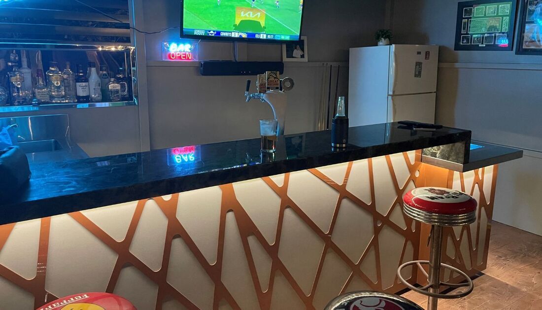 A Bar with Stools and A Television on The Wall  — Townsville Stainless Steel in Garbutt, QLD