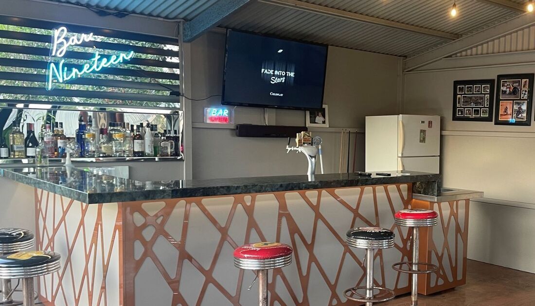 A Bar with Stools and A Television on The Wall  — Townsville Stainless Steel in Garbutt, QLD