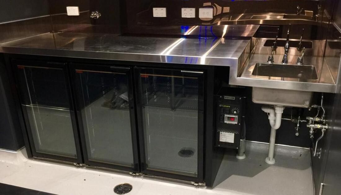 A Kitchen with A Sink, Refrigerator, and Stainless Steel Counter Top— Townsville Stainless Steel in Weipa, QLD