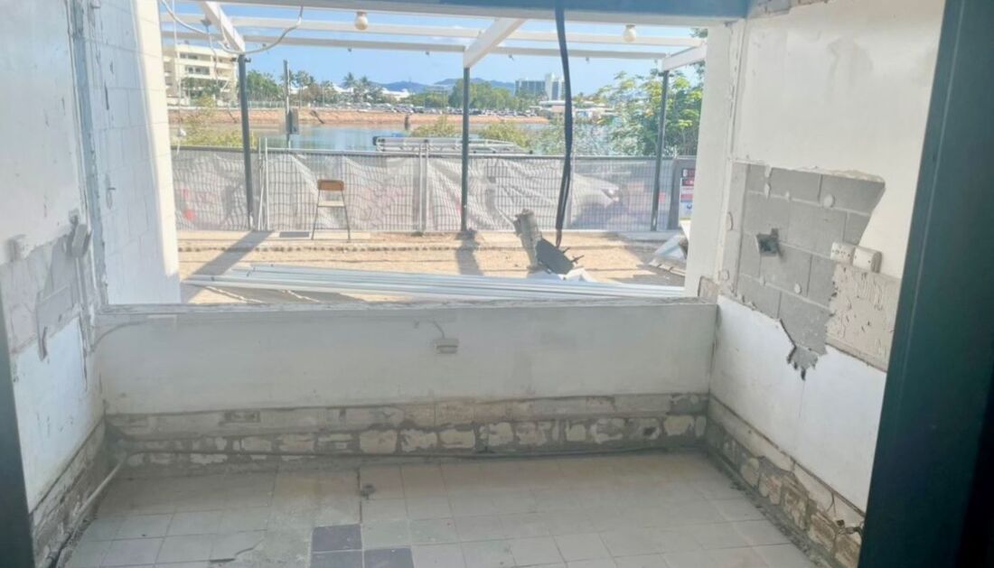 An Empty Room with A Window and A Fence in The Background — Townsville Stainless Steel in Garbutt, QLD