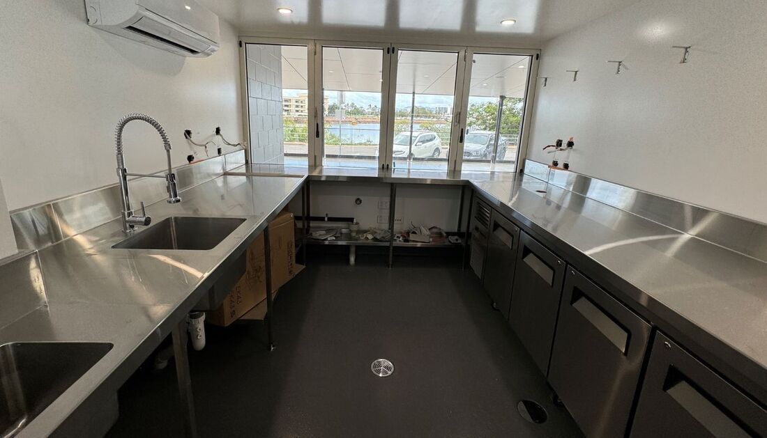 A Kitchen with Stainless Steel Counter Tops and A Sink — Townsville Stainless Steel in Garbutt, QLD