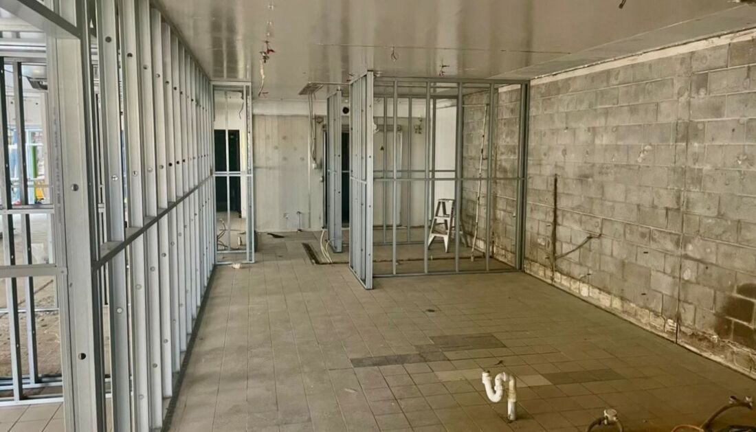 An Empty Room with A Brick Wall and A Metal Frame — Townsville Stainless Steel in Garbutt, QLD
