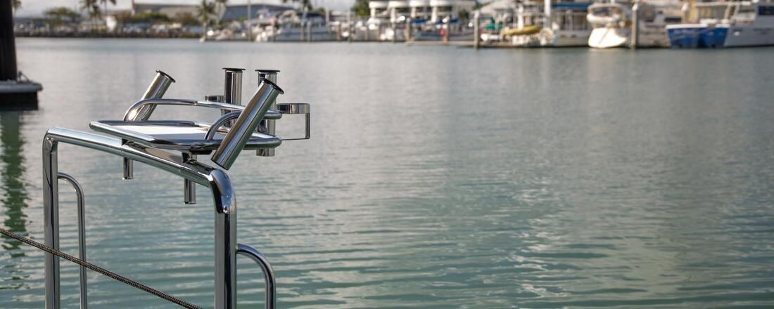 A Boat Is Docked in A Harbor with Boats  — Townsville Stainless Steel in Garbutt, QLD