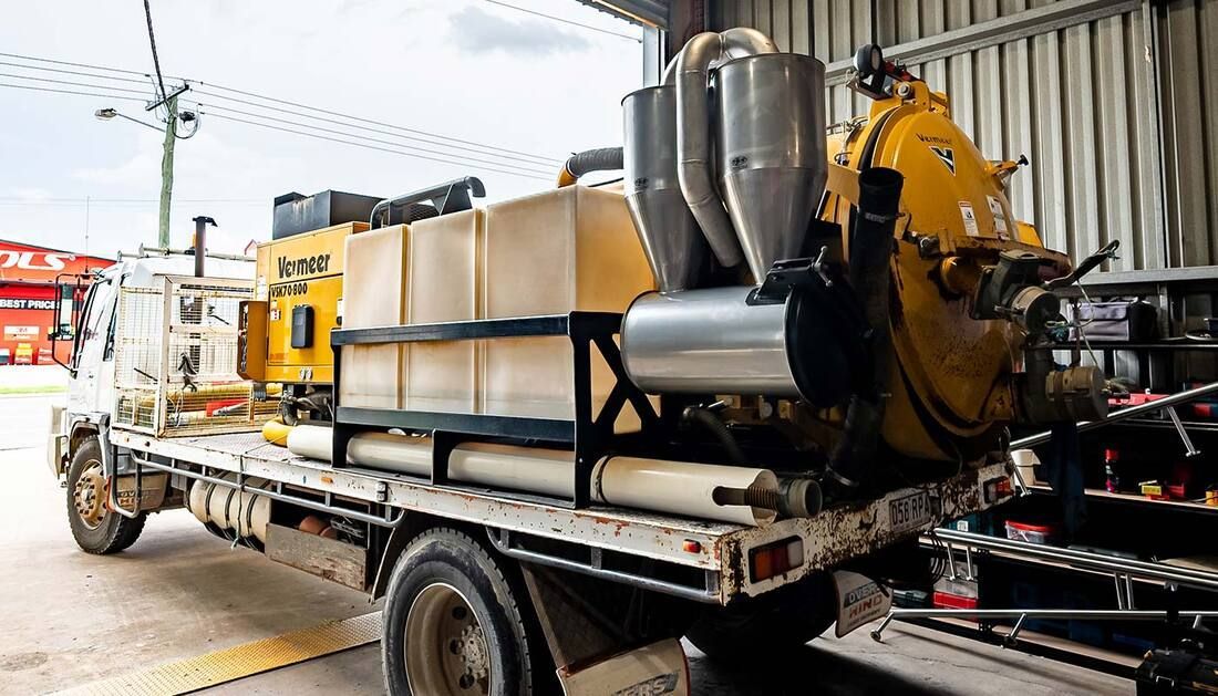 A Vacuum Truck Is Parked in A Garage — Townsville Stainless Steel in Garbutt, QLD