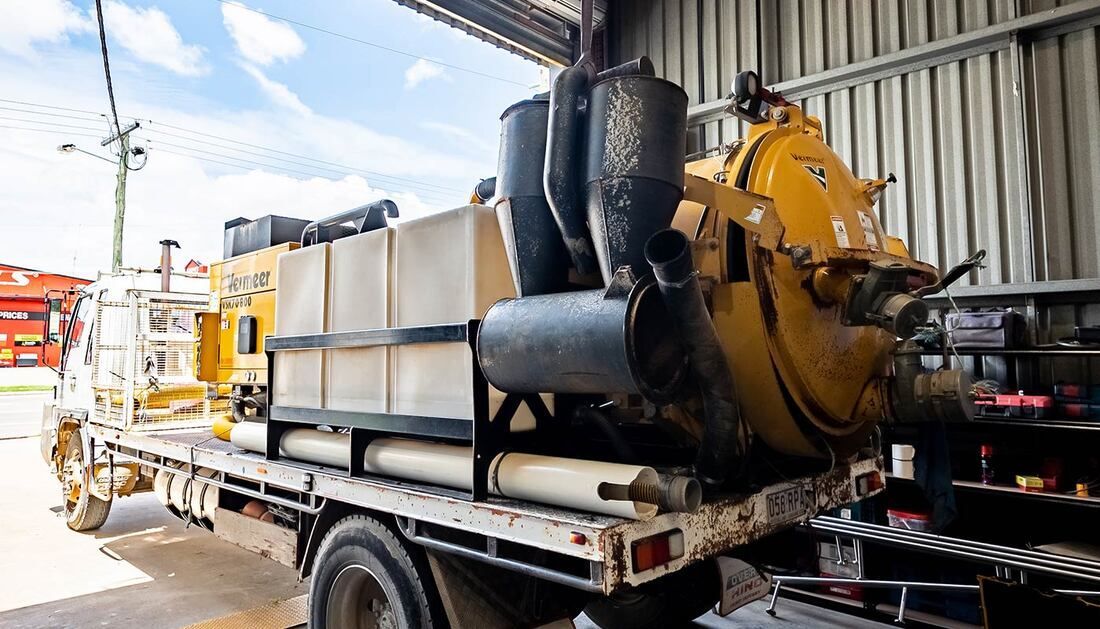 A Vacuum Truck Is Parked in A Garage — Townsville Stainless Steel in Garbutt, QLD