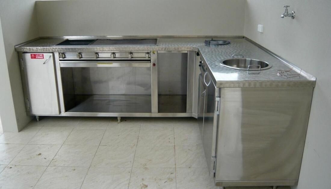 A Kitchen with Stainless Steel Cabinets and A Sink — Townsville Stainless Steel in Garbutt, QLD