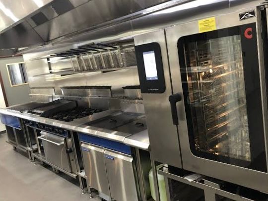 A Stainless Steel Commercial Oven in a Kitchen— Townsville Stainless Steel in Garbutt, QLD