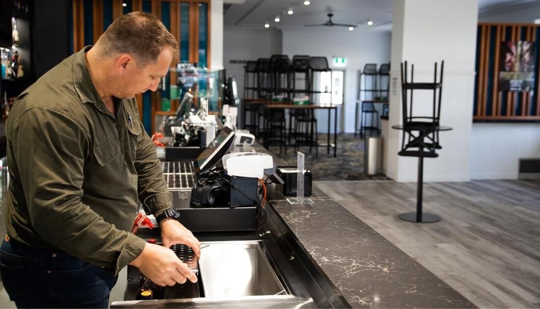 Man Organizing in Kitchen — Townsville Stainless Steel in Garbutt, QLD