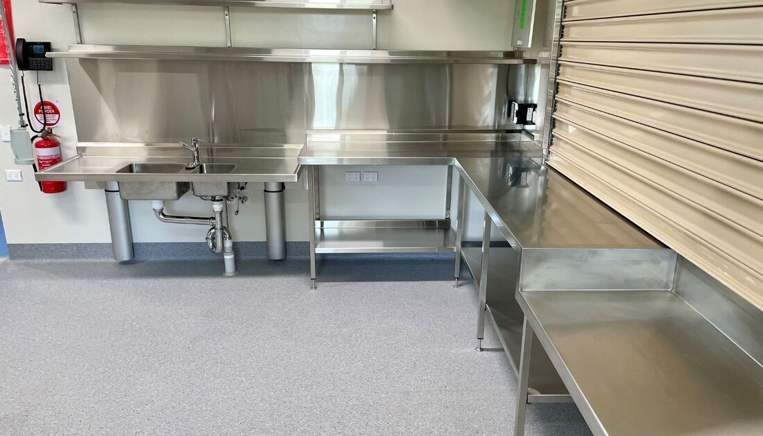 A Kitchen with Stainless Steel Appliances and A Sink — Townsville Stainless Steel in Garbutt, QLD