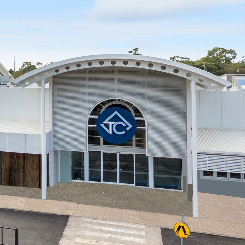A Building with A Blue TC Logo on It — Townsville Stainless Steel in Garbutt, QLD