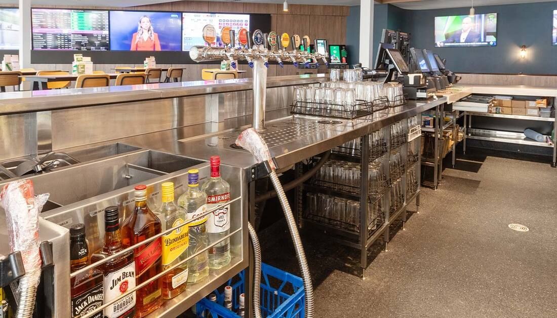 Steel Cabinet and Tables on Kitchen with Bottles — Townsville Stainless Steel in Garbutt, QLD
