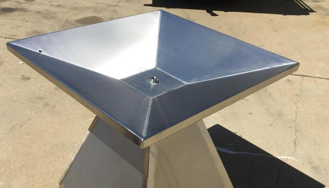 A Stainless Steel Bowl Is Sitting on A Concrete Surface — Townsville Stainless Steel in Garbutt, QLD