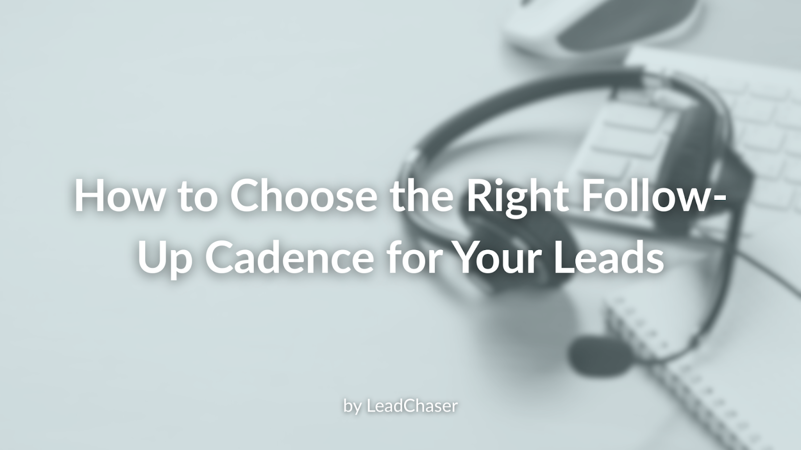 Headphones and keyboard on a desk, title: 