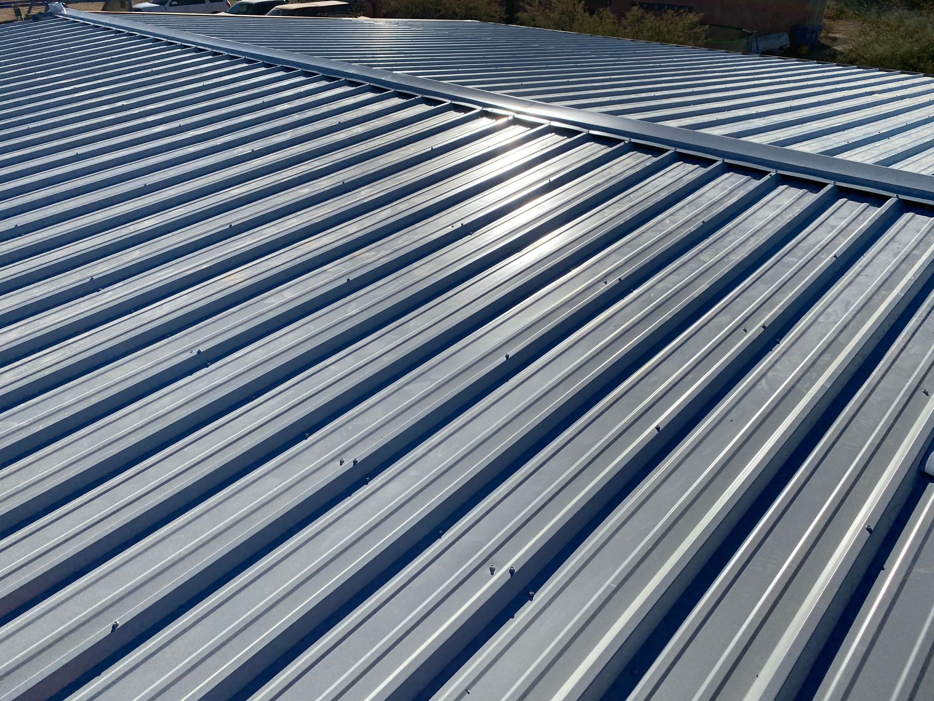 A close up of a metal roof on a building
